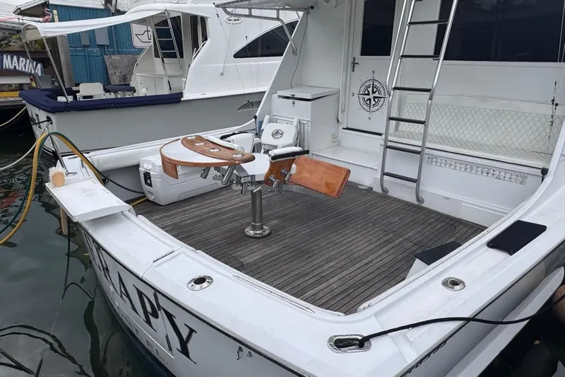  Yacht Photos Pics 1979 Hatteras 53 Motor Yacht with fishing chair and ladder on deck.