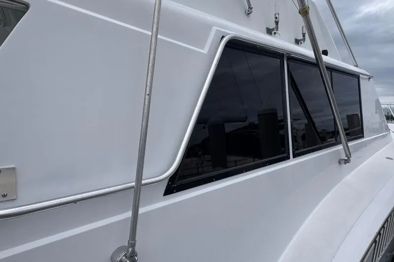  Yacht Photos Pics 1979 Hatteras 53 Motor Yacht side view with sleek windows and railing.