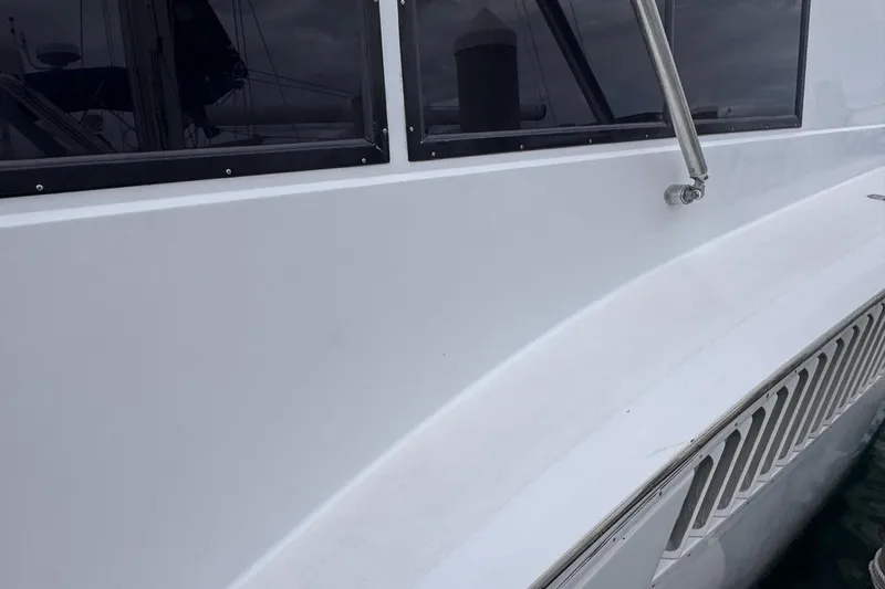  Yacht Photos Pics 1979 Hatteras 53 Motor Yacht exterior with sleek white finish and tinted windows.