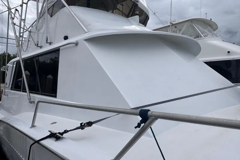  Yacht Photos Pics 1979 Hatteras 53 Motor Yacht with sleek white exterior and railing.