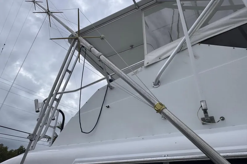  Yacht Photos Pics 1979 Hatteras 53 Motor Yacht, close-up of deck and rigging against cloudy sky.