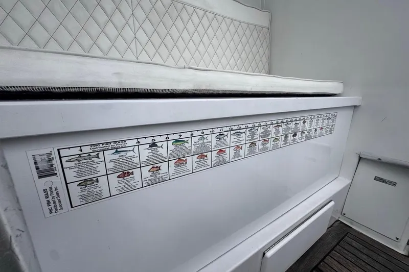  Yacht Photos Pics 1979 Hatteras 53 Motor Yacht with fish identification chart and cushioned seating.