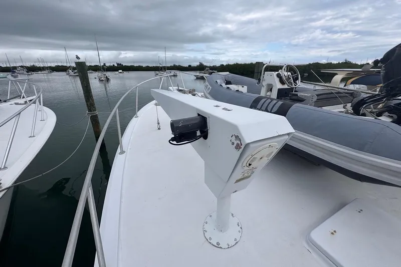  Yacht Photos Pics 1979 Hatteras 53 Motor Yacht deck with dinghy and overcast sky.