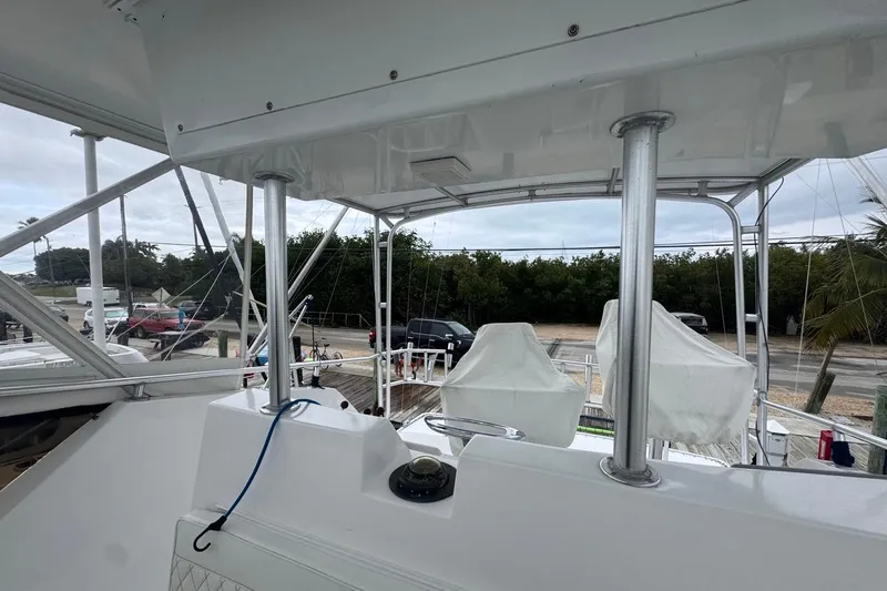  Yacht Photos Pics 1979 Hatteras 53 Motor Yacht deck with covered seating and railing.