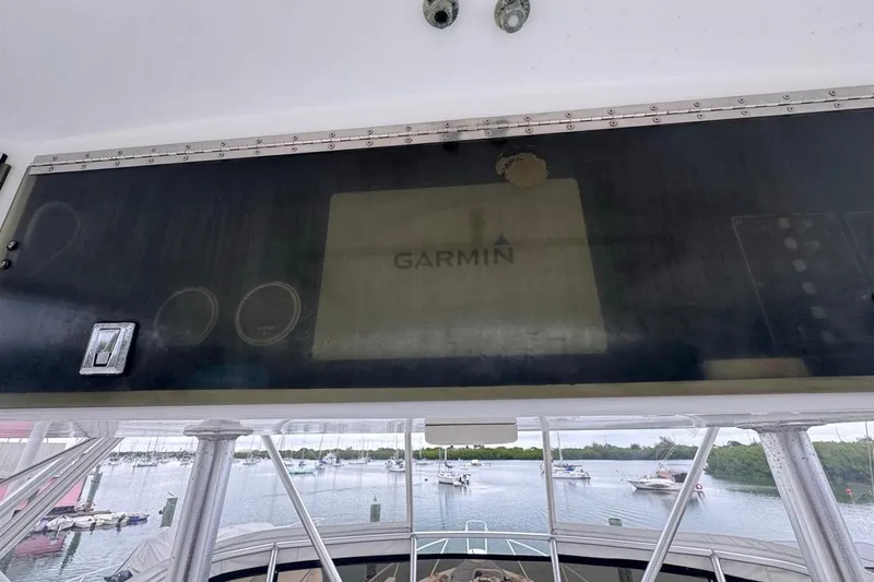  Yacht Photos Pics 1979 Hatteras 53 Motor Yacht helm with Garmin navigation system, overlooking marina.