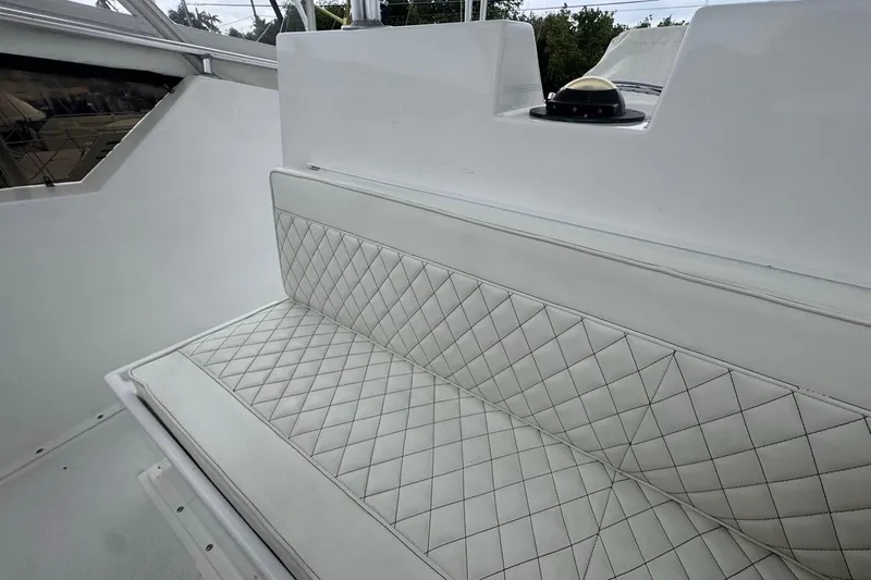  Yacht Photos Pics White quilted seating on 1979 Hatteras 53 Motor Yacht, showcasing luxury and comfort.