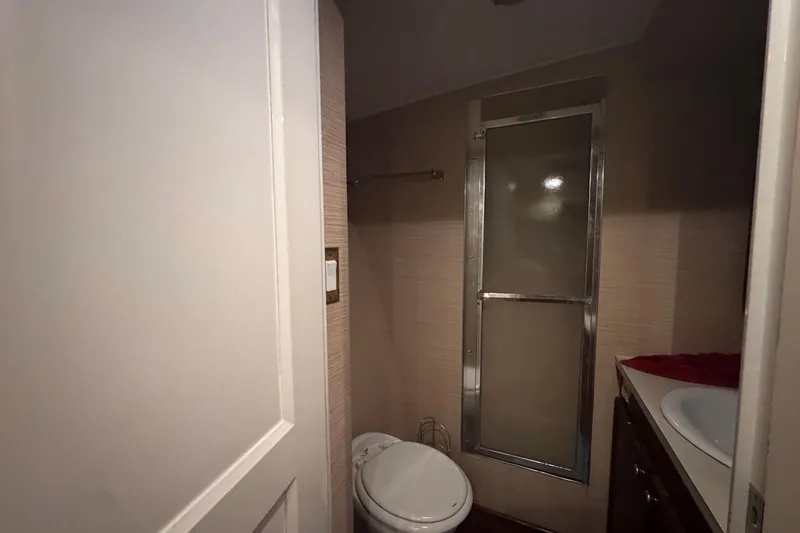  Yacht Photos Pics Bathroom interior of 1979 Hatteras 53 Motor Yacht with shower and toilet.