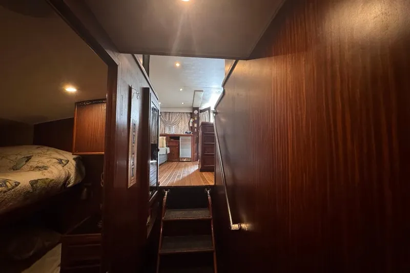  Yacht Photos Pics Interior of 1979 Hatteras 53 Motor Yacht with wooden paneling and cozy cabin.