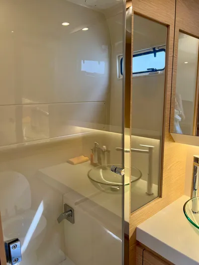  Yacht Photos Pics Luxurious bathroom in 2024 Solaris Power 44 Open yacht with modern fixtures.