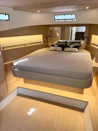  Yacht Photos Pics 2024 Solaris Power 44 Open yacht interior with modern bedroom design and ambient lighting.