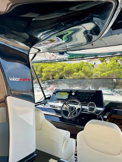  Yacht Photos Pics 2024 Solaris Power 44 Open yacht interior with modern helm and luxurious seating.