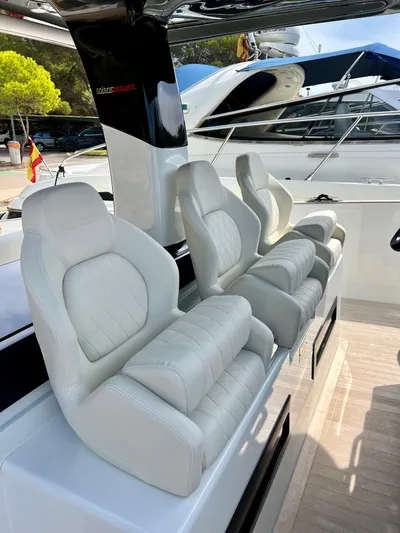  Yacht Photos Pics 2024 Solaris Power 44 Open luxury boat seats, featuring sleek white leather design.
