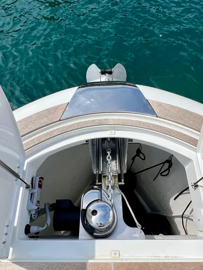  Yacht Photos Pics 2024 Solaris Power 44 Open yacht anchor compartment with clear view of turquoise water.