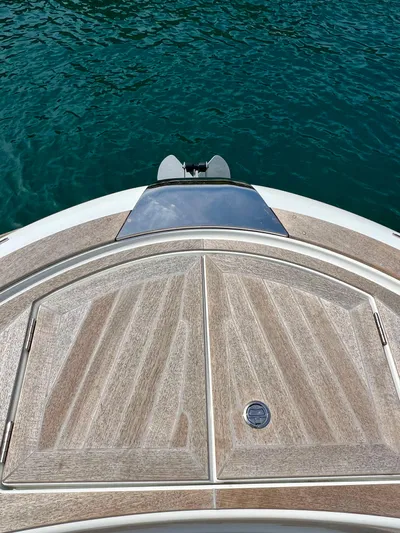  Yacht Photos Pics 2024 Solaris Power 44 Open yacht deck with elegant wood finish on blue water.