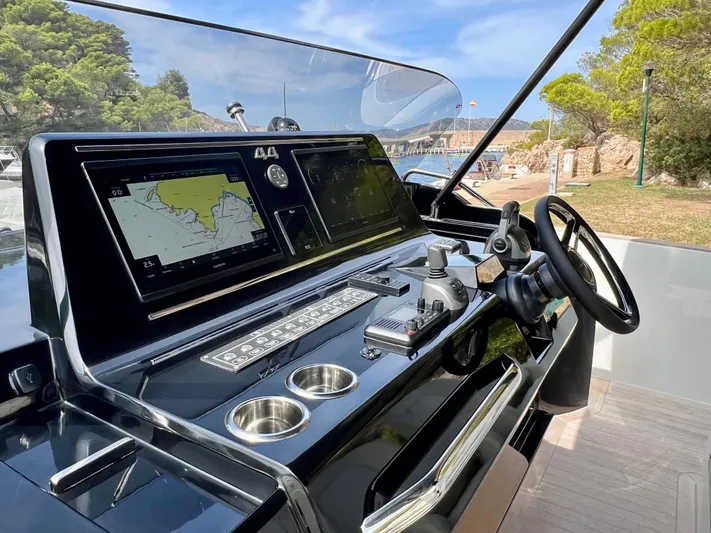  Yacht Photos Pics 2024 Solaris Power 44 Open yacht helm with navigation screens and controls.