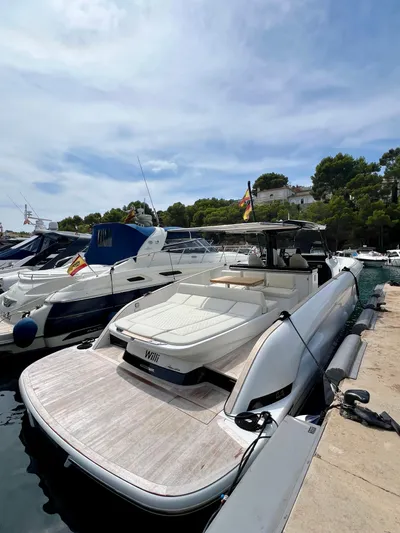  Yacht Photos Pics 2024 Solaris Power 44 Open yacht docked, featuring sleek design and spacious deck.