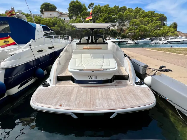  Yacht Photos Pics 2024 Solaris Power 44 Open yacht docked, featuring spacious seating and sleek design.