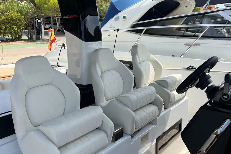  Yacht Photos Pics 2024 Solaris Power 44 Open yacht with luxurious white seating and sleek design.