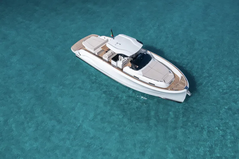  Yacht Photos Pics 2024 Solaris Power 44 Open yacht on clear turquoise water.