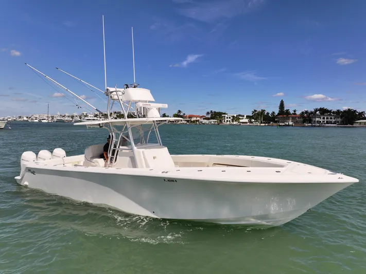  Yacht Photos Pics 2020 SeaVee 370z boat on calm water under a clear blue sky.
