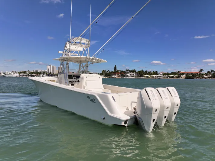  Yacht Photos Pics 2020 SeaVee 370z boat with triple outboard engines on calm water.
