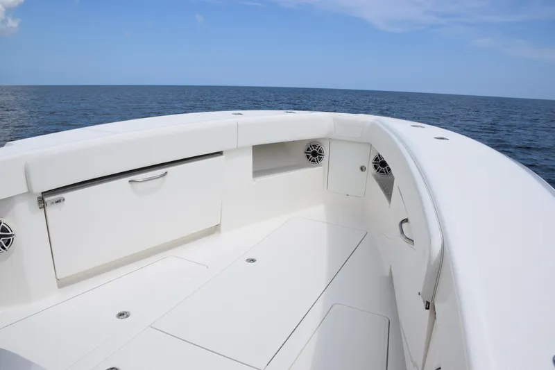  Yacht Photos Pics 2020 SeaVee 370z boat interior with ocean view, featuring sleek white design and storage compartments.