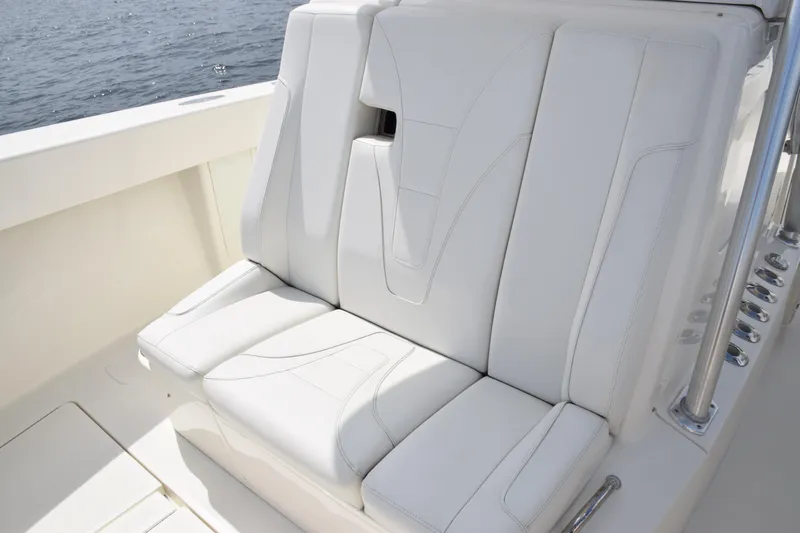  Yacht Photos Pics 2020 SeaVee 370z boat with white cushioned seating, ocean in background.