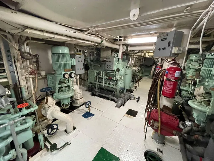 Khozam Yacht Photos Pics Engine room of 1974 Expedition vessel, SCHICHAU UNTERWESER AG, featuring machinery and safety equipment.