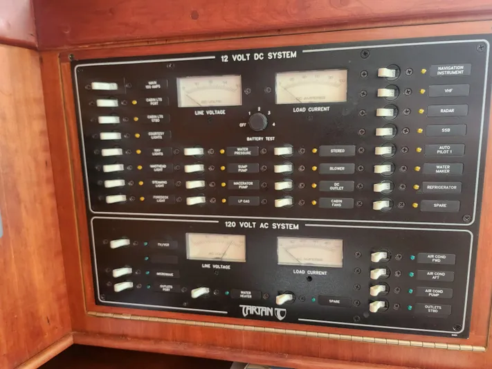 Sensation Yacht Photos Pics Electrical control panel on a 1998 Tartan 4100 yacht, featuring 12V DC and 120V AC systems.