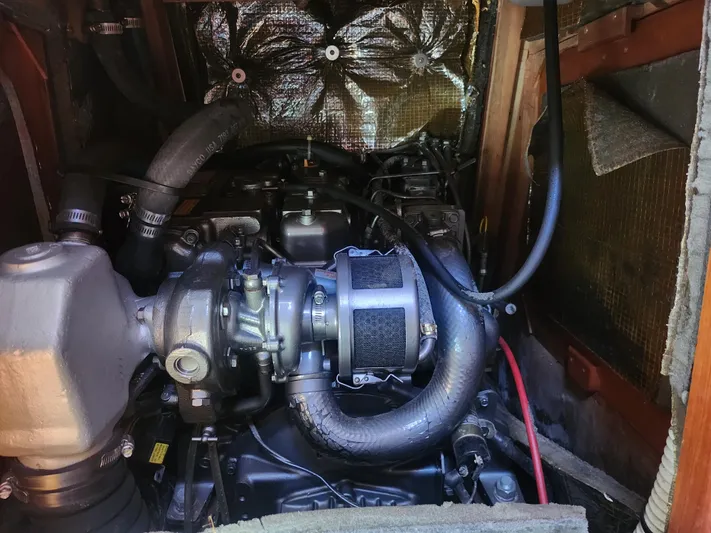 Sensation Yacht Photos Pics Engine compartment of a 1998 Tartan 4100 sailboat, showcasing mechanical components and insulation.