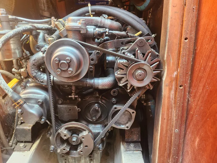 Sensation Yacht Photos Pics Engine of a 1998 Tartan 4100 sailboat, showcasing belts and pulleys.