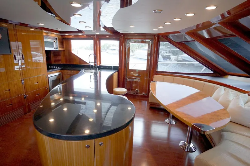 Robin's Nest Yacht Photos Pics Luxurious interior of 2008 Ocean Alexander 100 Skylounge Megayacht with modern kitchen and seating area.