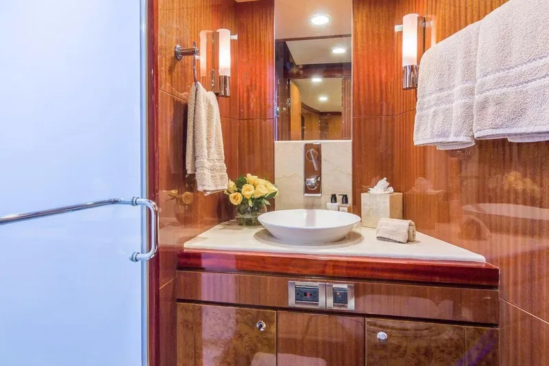Robin's Nest Yacht Photos Pics Luxurious bathroom on 2008 Ocean Alexander 100 Skylounge Megayacht with elegant wood finishes.