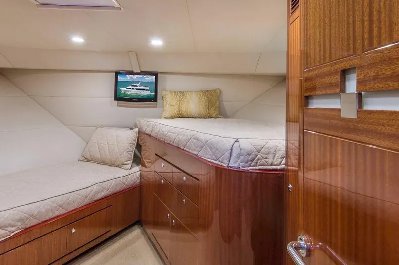 Robin's Nest Yacht Photos Pics Luxurious cabin interior of 2008 Ocean Alexander 100 Skylounge Megayacht with cozy beds and TV.