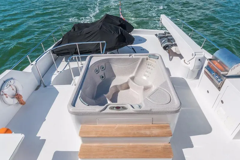 Robin's Nest Yacht Photos Pics Luxurious Ocean Alexander 100 Skylounge Megayacht deck with hot tub, 2008 model.