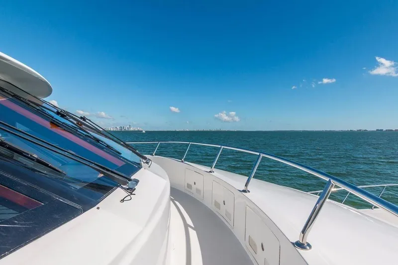 Robin's Nest Yacht Photos Pics 2008 Ocean Alexander 100 Skylounge Megayacht cruising on open sea under clear blue sky.