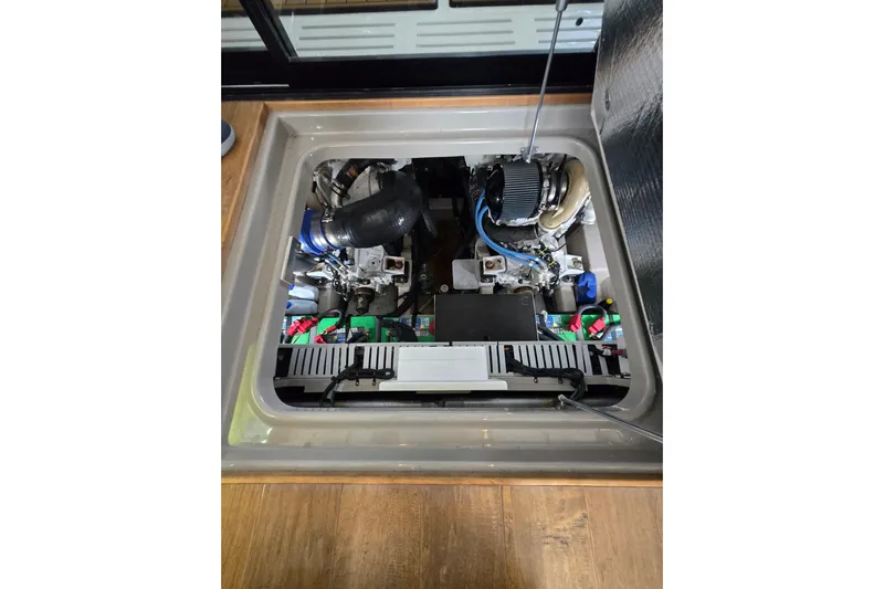 Tiger "times" 2 Yacht Photos Pics Engine compartment of 2017 Sea Ray Sundancer 400 yacht, showcasing mechanical components.