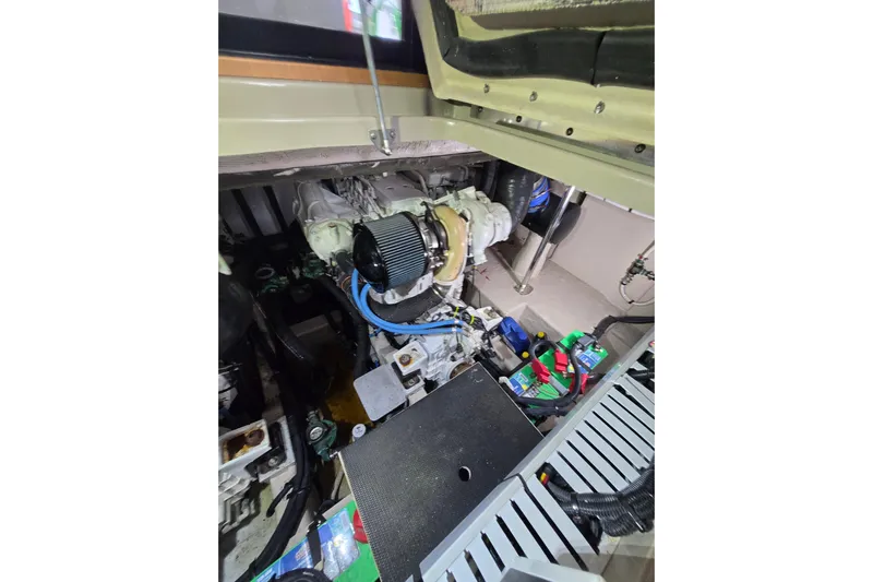 Tiger "times" 2 Yacht Photos Pics Engine compartment of a 2017 Sea Ray Sundancer 400 boat, showcasing mechanical components.