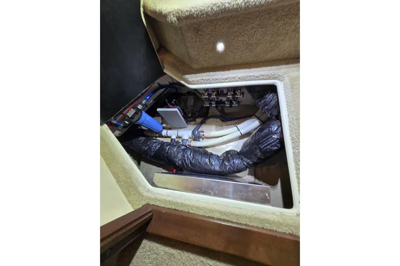 Tiger "times" 2 Yacht Photos Pics Engine compartment of 2017 Sea Ray Sundancer 400, showcasing mechanical components and wiring.