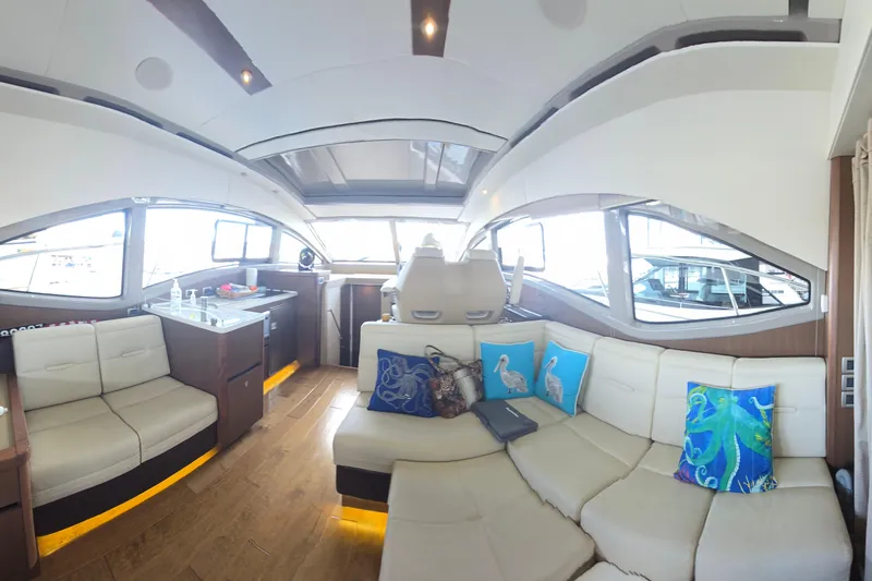 Tiger "times" 2 Yacht Photos Pics Luxurious interior of 2017 Sea Ray Sundancer 400 yacht with plush seating and vibrant decor.