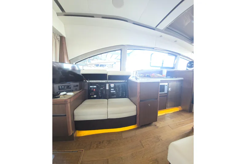 Tiger "times" 2 Yacht Photos Pics 2017 Sea Ray Sundancer 400 interior with modern kitchen and seating area.