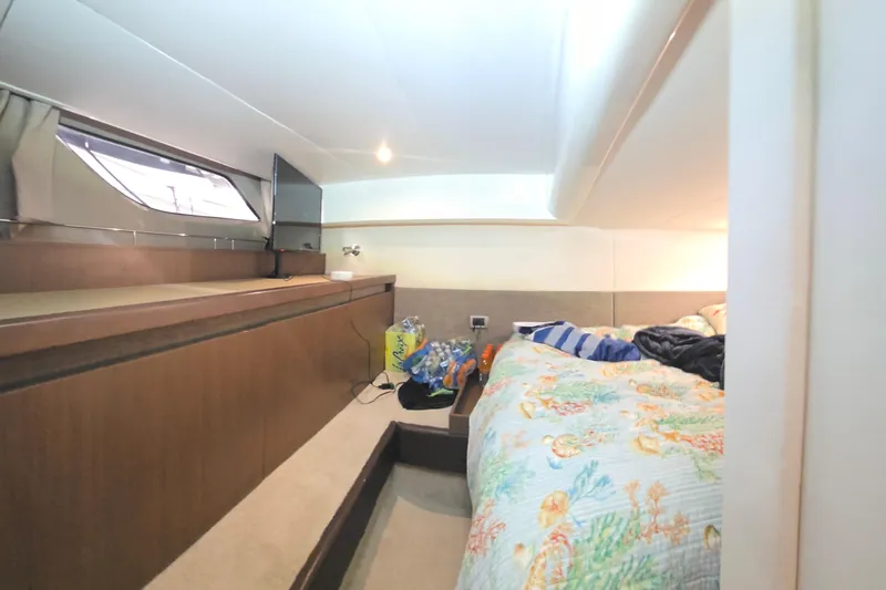 Tiger "times" 2 Yacht Photos Pics Interior cabin of 2017 Sea Ray Sundancer 400 with cozy bedding and storage.