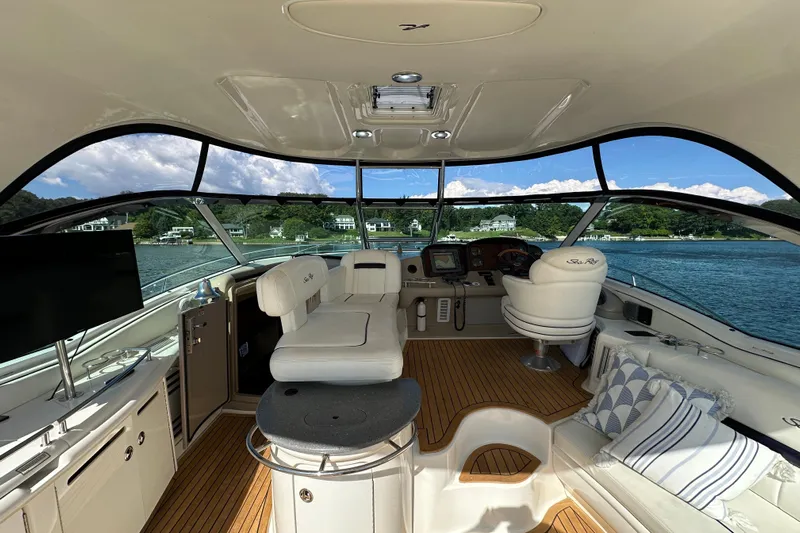 Apres Sea Yacht Photos Pics Interior of 2006 Sea Ray 52 Sundancer yacht with luxurious seating and scenic water view.