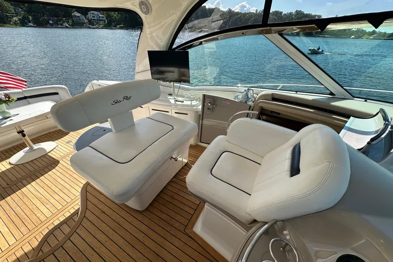 Apres Sea Yacht Photos Pics Luxurious 2006 Sea Ray 52 Sundancer yacht interior with plush seating and scenic water view.