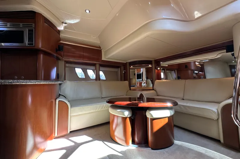 Apres Sea Yacht Photos Pics Luxurious interior of 2006 Sea Ray 52 Sundancer yacht with elegant seating and modern amenities.