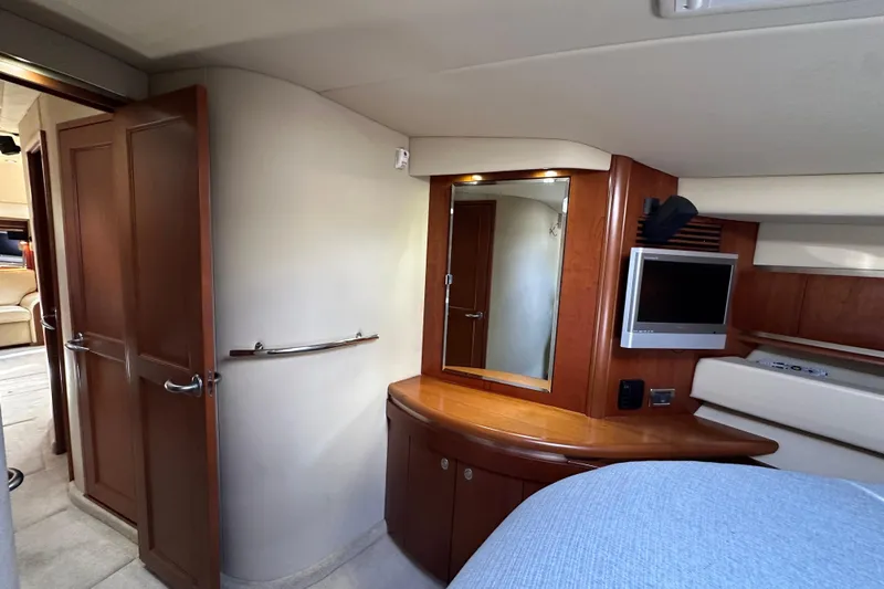 Apres Sea Yacht Photos Pics Luxurious interior of 2006 Sea Ray 52 Sundancer yacht with wood accents and modern amenities.