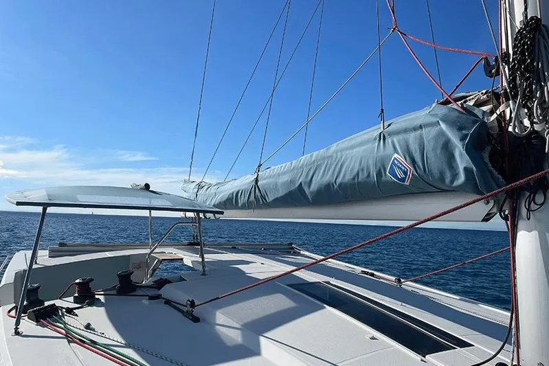  Yacht Photos Pics 2018 Fountaine Pajot Lucia 40 catamaran sailing on open sea under clear blue sky.