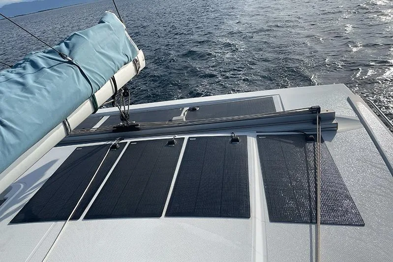  Yacht Photos Pics 2018 Fountaine Pajot Lucia 40 catamaran with solar panels on deck, sailing on open water.