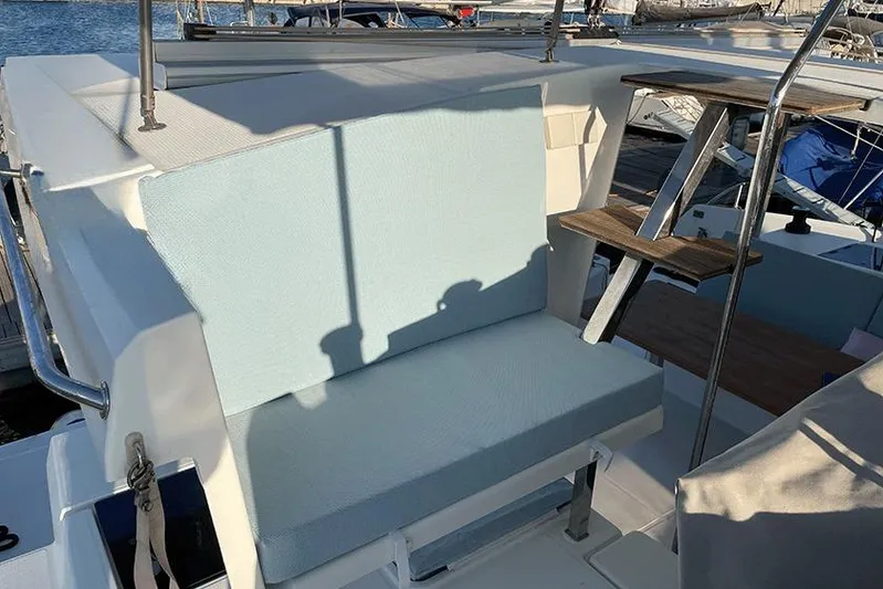  Yacht Photos Pics 2018 Fountaine Pajot Lucia 40 yacht seating area with stairs, docked at marina.