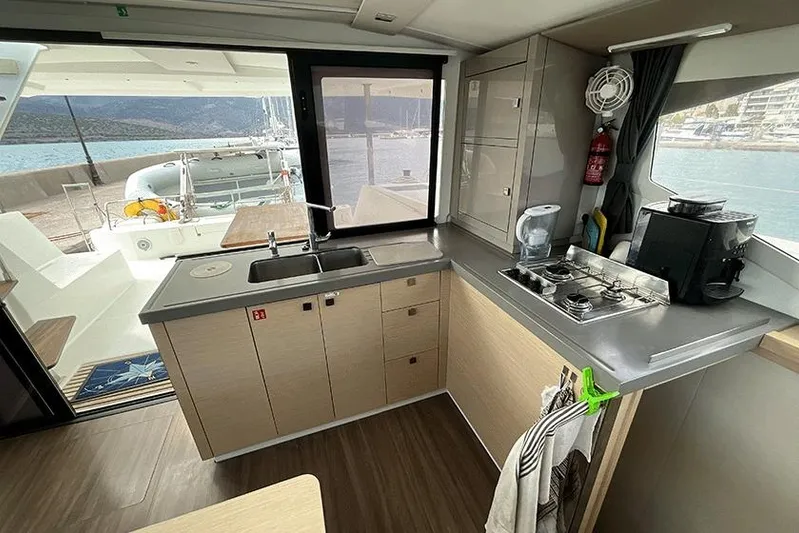  Yacht Photos Pics Modern kitchen interior of 2018 Fountaine Pajot Lucia 40 catamaran with sea view.